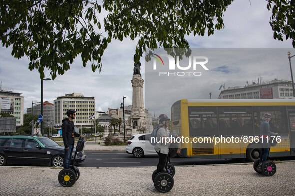 A group of people are seen taking a segway ride around the Marquez de Pombal monument. Lisbon, June 03, 2022. According to data from the Gen...