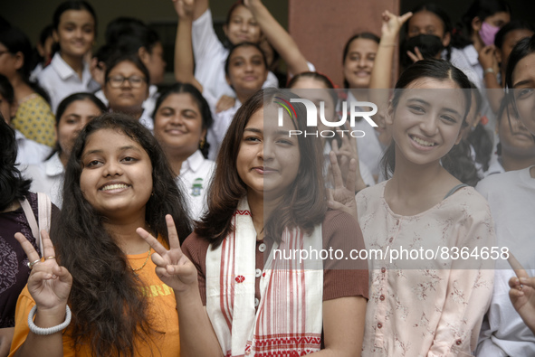 Students of St. Mary's English High School celebrate after their student Ashlesha Sarma (M) stood 7th rank in the HSLC class 10 examination,...