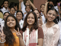 Students of St. Mary's English High School celebrate after their student Ashlesha Sarma (M) stood 7th rank in the HSLC class 10 examination,...