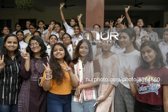 Students of St. Mary's English High School celebrate after their student Ashlesha Sarma (M) stood 7th rank in the HSLC class 10 examination,...