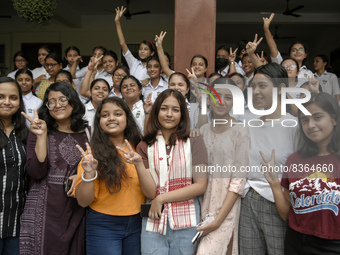 Students of St. Mary's English High School celebrate after their student Ashlesha Sarma (M) stood 7th rank in the HSLC class 10 examination,...