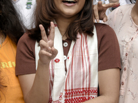 Student of St. Mary's English High School Ashlesha Sarma showing V sign after stood 7th rank in the HSLC class 10 examination, in Guwahati,...