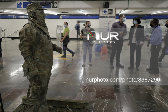 José Miguel Moctezuma, characterised as Don Ferro Ferrocarrilero, during a performance as a living statue inside the Zócalo metro station in...