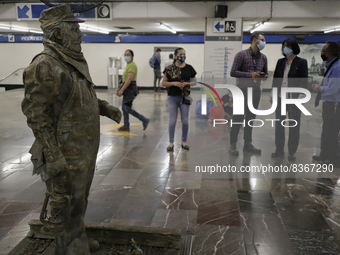 José Miguel Moctezuma, characterised as Don Ferro Ferrocarrilero, during a performance as a living statue inside the Zócalo metro station in...