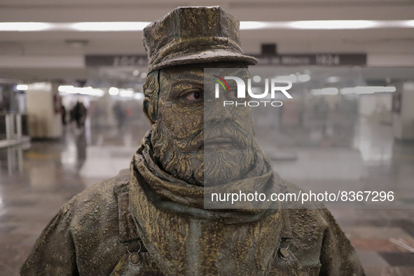 José Miguel Moctezuma, characterised as Don Ferro Ferrocarrilero, during a performance as a living statue inside the Zócalo metro station in...