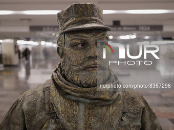 José Miguel Moctezuma, characterised as Don Ferro Ferrocarrilero, during a performance as a living statue inside the Zócalo metro station in...