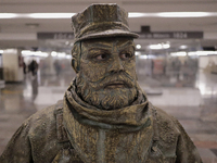 José Miguel Moctezuma, characterised as Don Ferro Ferrocarrilero, during a performance as a living statue inside the Zócalo metro station in...