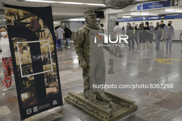 José Miguel Moctezuma, characterised as Don Ferro Ferrocarrilero, during a performance as a living statue inside the Zócalo metro station in...