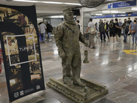 José Miguel Moctezuma, characterised as Don Ferro Ferrocarrilero, during a performance as a living statue inside the Zócalo metro station in...