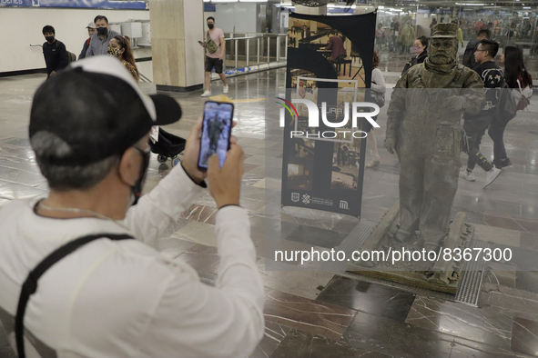 A person portrays José Miguel Moctezuma, characterised as Don Ferro Ferrocarrilero, during a performance as a living statue inside the Zócal...