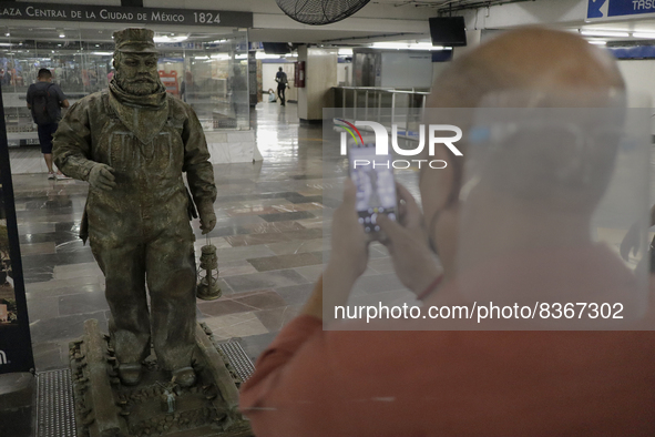 A person portrays José Miguel Moctezuma, characterised as Don Ferro Ferrocarrilero, during a performance as a living statue inside the Zócal...