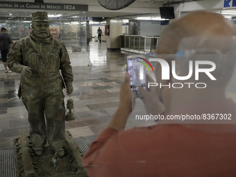 A person portrays José Miguel Moctezuma, characterised as Don Ferro Ferrocarrilero, during a performance as a living statue inside the Zócal...