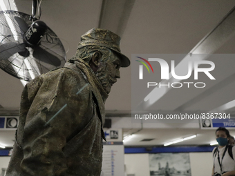 José Miguel Moctezuma, characterised as Don Ferro Ferrocarrilero, during a performance as a living statue inside the Zócalo metro station in...