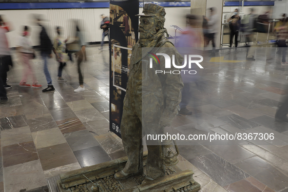 José Miguel Moctezuma, characterised as Don Ferro Ferrocarrilero, during a performance as a living statue inside the Zócalo metro station in...