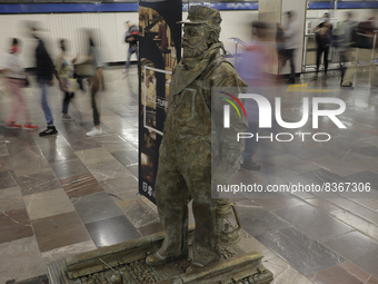 José Miguel Moctezuma, characterised as Don Ferro Ferrocarrilero, during a performance as a living statue inside the Zócalo metro station in...