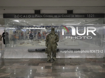 José Miguel Moctezuma, characterised as Don Ferro Ferrocarrilero, during a performance as a living statue inside the Zócalo metro station in...