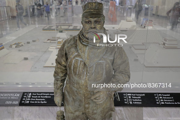 José Miguel Moctezuma, characterised as Don Ferro Ferrocarrilero, during a performance as a living statue inside the Zócalo metro station in...