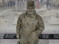 José Miguel Moctezuma, characterised as Don Ferro Ferrocarrilero, during a performance as a living statue inside the Zócalo metro station in...