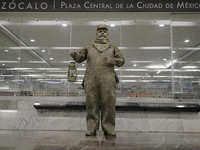 José Miguel Moctezuma, characterised as Don Ferro Ferrocarrilero, during a performance as a living statue inside the Zócalo metro station in...