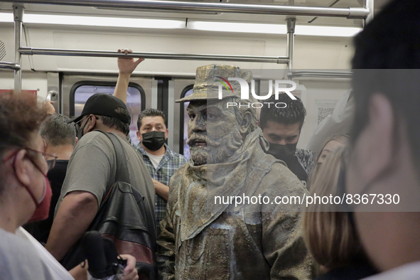 José Miguel Moctezuma, characterised as Don Ferro Ferrocarrilero, during a performance as a living statue inside a carriage in the Zócalo me...