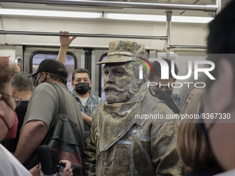 José Miguel Moctezuma, characterised as Don Ferro Ferrocarrilero, during a performance as a living statue inside a carriage in the Zócalo me...