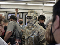 José Miguel Moctezuma, characterised as Don Ferro Ferrocarrilero, during a performance as a living statue inside a carriage in the Zócalo me...