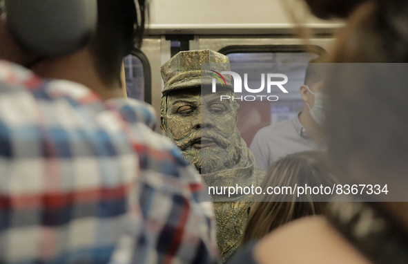 José Miguel Moctezuma, characterised as Don Ferro Ferrocarrilero, during a performance as a living statue inside a carriage in the Zócalo me...