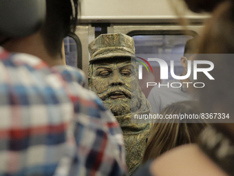 José Miguel Moctezuma, characterised as Don Ferro Ferrocarrilero, during a performance as a living statue inside a carriage in the Zócalo me...