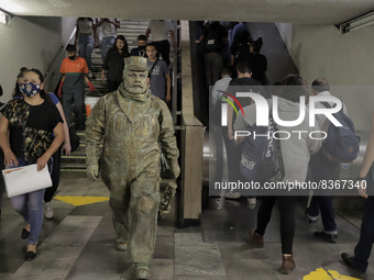 José Miguel Moctezuma, characterised as Don Ferro Ferrocarrilero, during a performance as a living statue inside the Bellas Artes metro stat...