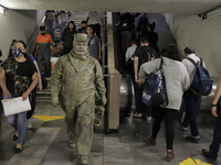 José Miguel Moctezuma, characterised as Don Ferro Ferrocarrilero, during a performance as a living statue inside the Bellas Artes metro stat...