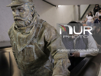 José Miguel Moctezuma, characterised as Don Ferro Ferrocarrilero, during a performance as a living statue on the escalators inside the Bella...