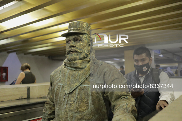 José Miguel Moctezuma, characterised as Don Ferro Ferrocarrilero, during a performance as a living statue on the escalators inside the Bella...