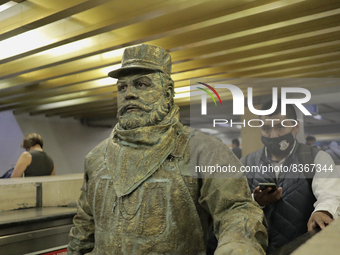 José Miguel Moctezuma, characterised as Don Ferro Ferrocarrilero, during a performance as a living statue on the escalators inside the Bella...