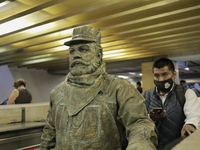 José Miguel Moctezuma, characterised as Don Ferro Ferrocarrilero, during a performance as a living statue on the escalators inside the Bella...