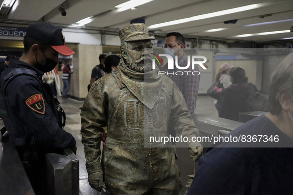 José Miguel Moctezuma, characterised as Don Ferro Ferrocarrilero, during a performance as a living statue inside the Bellas Artes metro stat...