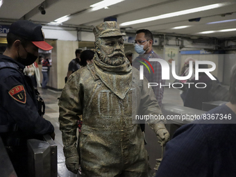 José Miguel Moctezuma, characterised as Don Ferro Ferrocarrilero, during a performance as a living statue inside the Bellas Artes metro stat...