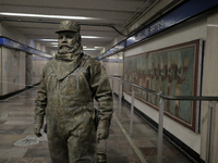 José Miguel Moctezuma, characterised as Don Ferro Ferrocarrilero, during a performance as a living statue inside the Bellas Artes metro stat...