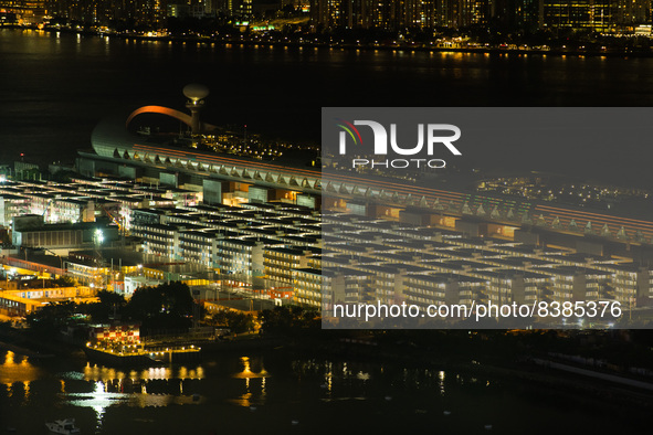 Hong Kong, China, 9 Jun 2022, The Kai Tak Cruise Terminal and the Kai Tak Community Isolation Facility for Covid patients are seen at night....