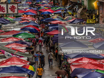 Hong Kong, China, 11 Jun 2022, The Fa Yuen street market under the rain. (