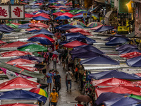 Hong Kong, China, 11 Jun 2022, The Fa Yuen street market under the rain. (