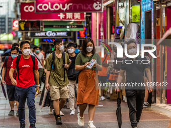 Hong Kong, China, 11 Jun 2022, Masked people walk on Sai Yeung Choi South Street in Mongkok. (