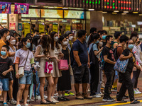 Hong Kong, China, 11 Jun 2022, People stack up at a street crossing in Mongkok. (