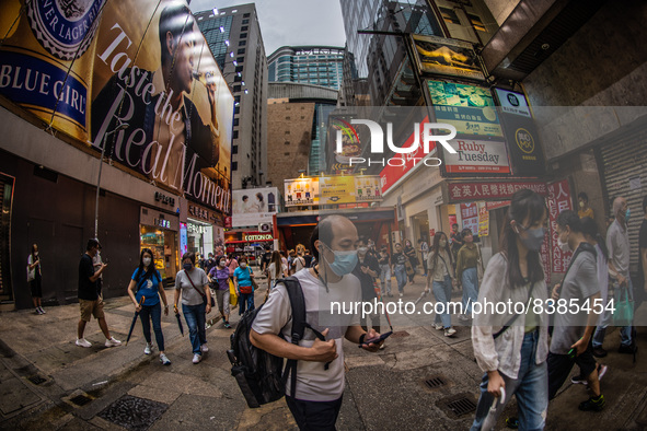 Hong Kong, China, 11 Jun 2022, People crowd the streets in Mongkok, despite a rise in the numbers of Covid contaminations. 