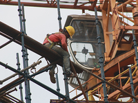  Labourers work at a construction site of a metro rail station in Kolkata, India, June 12,2022. (