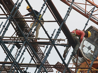  Labourers work at a construction site of a metro rail station in Kolkata, India, June 12,2022. (