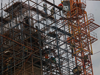  Labourers work at a construction site of a metro rail station in Kolkata, India, June 12,2022. (