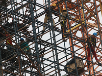  Labourers work at a construction site of a metro rail station in Kolkata, India, June 12,2022. (