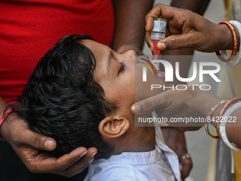 A boy receives polio drops during a pulse polio immunisation programme in Kolkata on June 19 2022. The immunisation programme started in a t...