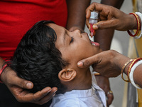 A boy receives polio drops during a pulse polio immunisation programme in Kolkata on June 19 2022. The immunisation programme started in a t...