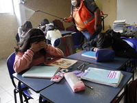 Civil Protection workers spread disinfectant inside class rooms of a primary school  to avoid new Covid-19 infections after an increase of C...